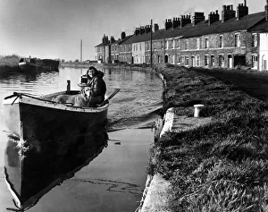 A girl and her dog on a peaceful boat trip on the Leeds and Liverpool canal near Ormskirk A girl and her dog on a peaceful boat trip on the Leeds and Liverpool canal near Ormskirk
