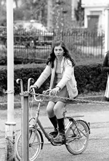 A girl riding her bike in a street in a French town April 1975 75-2072-016 A girl riding her bike in a street in a French town April 1975 75-2072-016