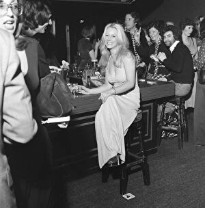 Images Dated 4th February 1976: A girl sitting alone at the bar inside the nightclub Slack Alice in Manchester which