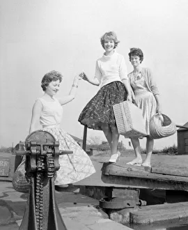 Three girls preparing for a picnic along the side of the canal at Perry Barr Three girls preparing for a picnic along the side of the canal at Perry Barr