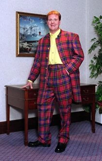 Images Dated 14th June 1996: Glasgow Rangers footballer Paul Gascoigne dressed in a tartan suit. 14th June 1996