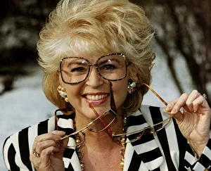 Images Dated 14th February 1991: Gloria Hunniford TV Presenter holding glasses in hand voted spectacle wearer of the Year