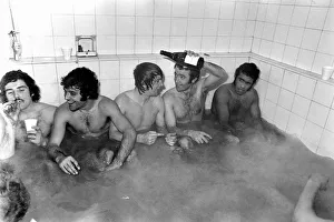Goal scorer Suggett raises champagne with team mates. Left to right Liverpoorl, Morris Goal scorer Suggett raises champagne with team mates. Left to right Liverpoorl, Morris