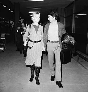 Goldie Hawn, American actress with husband Gus Trikonis, at London Heathrow Airport
