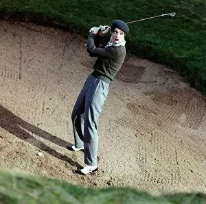 Images Dated 17th January 1996: Golf Fashion female golfer in bunker grey trousers