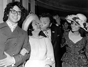 Former Goon Harry Secombe receives a kiss from his wife Myra at the Variety