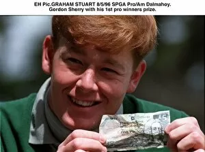 Images Dated 8th May 1996: Gordon Sherry golfer holds crumpled five pound note fiver at SPGA ProAm tournament at