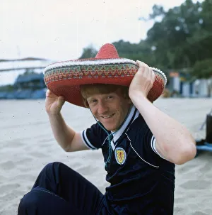 Gordon Strachan wearing a Scotland strip and a sombrero as he relaxes during the 1982 Gordon Strachan wearing a Scotland strip and a sombrero as he relaxes during the 1982