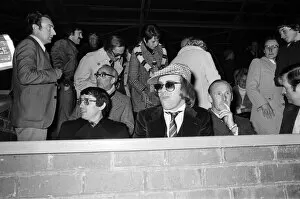 Images Dated 25th October 1977: Graham Taylor and Elton John watching the football match, West Bromwich Albion v Watford