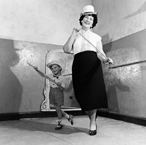 A grandmother teachers her grandson how to dance. 21st June 1955 A grandmother teachers her grandson how to dance. 21st June 1955