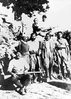 Greek guerialla fighters in the mountains of Crete wearing the traditional headdress Greek guerialla fighters in the mountains of Crete wearing the traditional headdress