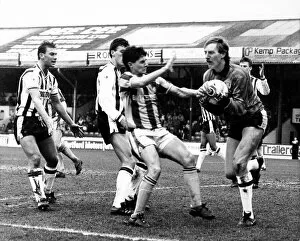Grimsby town football club Steve Sherwood holds on from Tony Dows March 1989