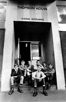 Images Dated 12th September 1970: A group of skinheads sitting on the steps of Thomson House, works entrance