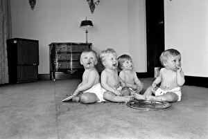 Images Dated 29th April 1975: A group of young babies seen here getting into a mess with a chocolate cake at a babies