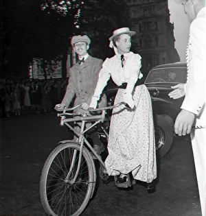 Guests arrive in Edwardian dress on a bicycle made for two for the premiere of " Guests arrive in Edwardian dress on a bicycle made for two for the premiere of "