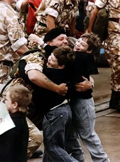 Images Dated 1st May 1991: Gulf War reunion A soldier is met by his two children returning from Gulf War