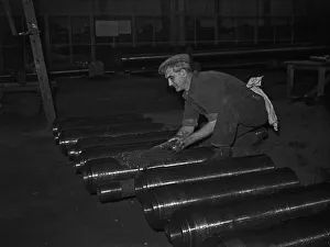 Gun barrels being greased before being attached to tanks under construction at the Royal Gun barrels being greased before being attached to tanks under construction at the Royal