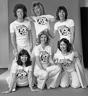 Images Dated 29th January 1976: Guys N Dolls pop group wearing Daily Mirror Pop Club T-shirts 29th January 1976