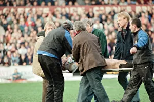 Images Dated 13th December 1997: Gwyn Jones (number 7 ) is stretchered off the ground during the Cardiff verses Swansea