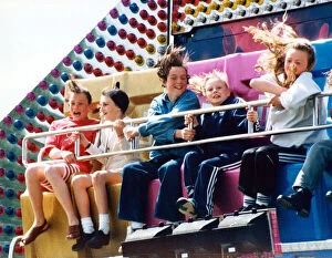 Images Dated 30th May 1994: A hair raising experience for youngsters on one of the rides at the Clairville Common