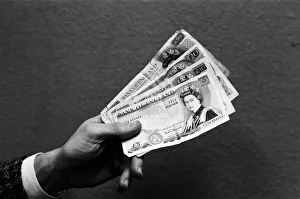 A handful of bank notes. 24th February 1987 A handful of bank notes. 24th February 1987