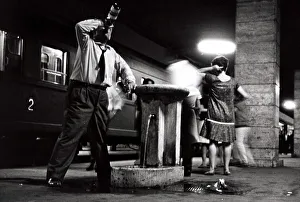A happy man leans against the drinking fountain at Naples Station - June 1962 A happy man leans against the drinking fountain at Naples Station - June 1962