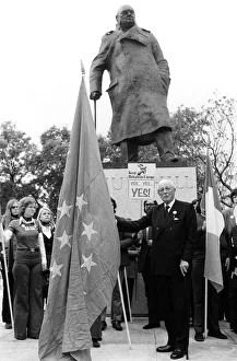 Harold MacMillan March 1975 holding the European flag under the statue of Sir Winston Harold MacMillan March 1975 holding the European flag under the statue of Sir Winston