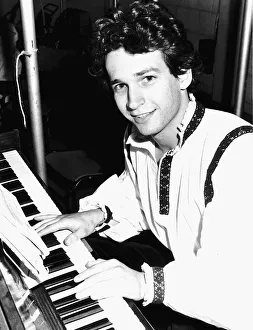 Harry Crosby actor and musician relaxes at piano Harry Crosby actor and musician relaxes at piano