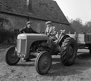 Photography And Film Gallery: Harry Ferguson The designer of the Ferguson Tractor driving a tractor with trailer