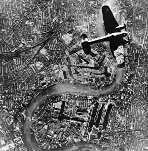 Plane Gallery: A Heinkel 111 bomber aircraft of the German Luftwaffe flies over Tower Bridge