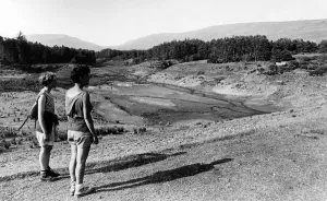 Hikers by the drought effected Neuadd Lower Reservoir, in the Brecon Beacons, South Wales Hikers by the drought effected Neuadd Lower Reservoir, in the Brecon Beacons, South Wales