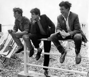 Holidays: Daily mirror beach wear show. Some lads watching during their break time Holidays: Daily mirror beach wear show. Some lads watching during their break time