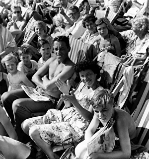 Holidays: Holiday makers Sunbathing whilst watching the Minor Beach Fashion Show Holidays: Holiday makers Sunbathing whilst watching the Minor Beach Fashion Show