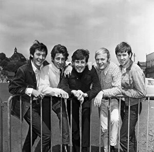 Images Dated 23rd July 2014: The Hollies pop group in happy mood in Stockport after hearing news that their latest