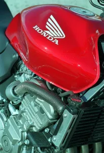 The Honda Hornet 600CC Motorbike April 1998 Fuel Tank badge and engine The Honda Hornet 600CC Motorbike April 1998 Fuel Tank badge and engine