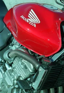 The Honda Hornet 600CC Motorbike April 1998 Fuel Tank badge and engine The Honda Hornet 600CC Motorbike April 1998 Fuel Tank badge and engine