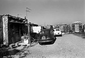 Housing and motor cars in a poor suburb on the outskirts of Rome, Italy April 1975 Housing and motor cars in a poor suburb on the outskirts of Rome, Italy April 1975