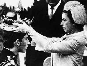 Images Dated 21st April 2015: HRH Queen Elizabeth II places the crown on the head of Prince Charles in July 1969