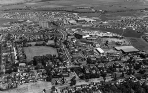 The huddled rooftops, the sprawling streets, green trees and multi-storey flats The huddled rooftops, the sprawling streets, green trees and multi-storey flats