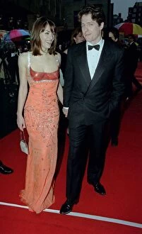 Images Dated 19th April 1998: Hugh Grant Actor April 98 Arriving for the BAFT Aawards 1998 with girlfriend Liz