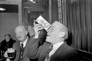 Humour/Unusual. John Mitchell balancing a pound note. February 1975 75-00662-002