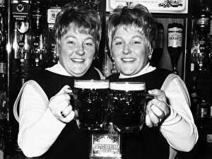 Images Dated 18th October 1977: Identical twin barmaids Joan Metcalf and Marie Dunn seen here behind the bar 1977