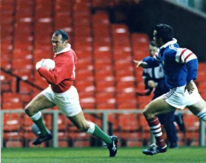 Ieuan Evans on a break for Wales against France. 1998 Ieuan Evans on a break for Wales against France. 1998