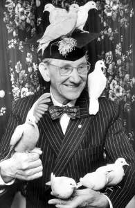 Illusionist Baron Houston with his doves. 3rd May 1977 Doves Birds Illusionist Baron Houston with his doves. 3rd May 1977 Doves Birds