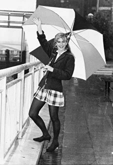 Images Dated 5th June 1992: Imogen Stubbs Actress holding up Umbrella in rain and waving