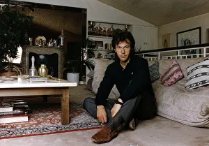 Images Dated 23rd July 1991: Imran Khan Cricket sitting on floor in living room in front of sofa at his home