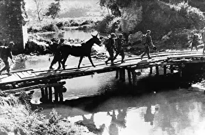 00154 Gallery: US infantry of Mars Task Force cross temporary bridge in Burma during WW2