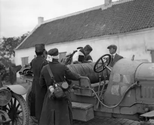 Injured Belgian soldiers seen here getting into a motor car prior to being transported Injured Belgian soldiers seen here getting into a motor car prior to being transported