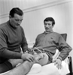 Injured Liverpool player Tommy Smith receives treatment from Bob Paisley in the treatment Injured Liverpool player Tommy Smith receives treatment from Bob Paisley in the treatment