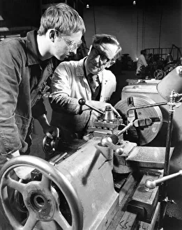Instructor Bobby Hunter demonstrates lathe turning to apprentice Ian Summerville Instructor Bobby Hunter demonstrates lathe turning to apprentice Ian Summerville
